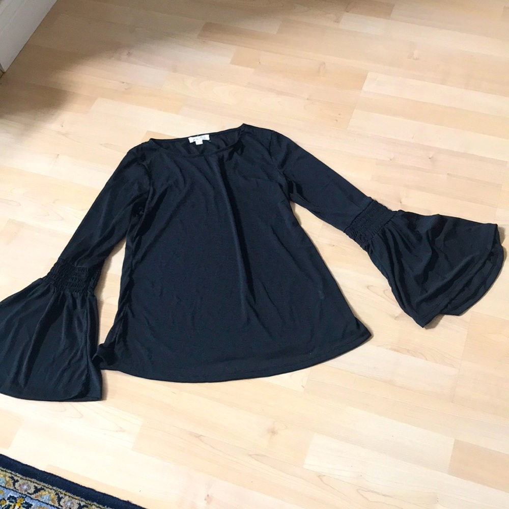 Brand new. Small. Long unique sleeves.